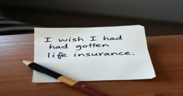 Image: A handwritten note: “I wish I had gotten life insurance