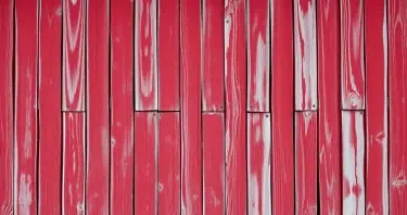 severely weathered and faded red barn texture background