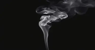 Photo realistic single plume of smoke rising from the bottom of the image on a black background