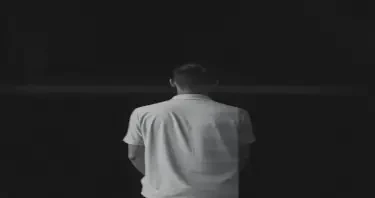 glitch art with high distortion, high level artefacts, horizontal scan lines and digital interference, vertical portrait of man from behind in the distance, minimal dark grey background, horizontally distorted figure with scan line interference pattern, soft diffused lighting, corrupted data aesthetic with noise texture and horizontal artifacts, colour tapering to black and white --ar 9:16 --quality 2 --style raw --profile ue2yzjl --stylize 400 --v 6.1