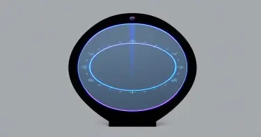A tall, freestanding oval mirror unit measuring approximately 7 feet high and 3 feet wide, with a flawless, reflective surface. The mirror is framed in polished black onyx, matte in finish, with no visible seams. Two concentric LED-style rings encircle the mirror: the outer ring is electric blue and positioned just inside the frame, while the inner ring is violet and approximately 60% the diameter of the mirror. Between these rings, faint luminous markings and symbols suggest encoded information, softly pulsing. The top center of the unit houses a subtle projection module — a small inset lens that emits a faint vertical glow upward. The background is evenly lit in neutral gray to highlight the mirror without shadow. No human figure is present. The mirror stands in isolation as a sacred tech object.