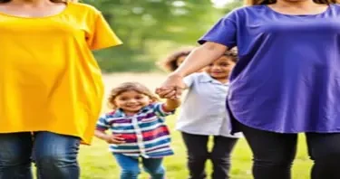 A group of single mom's holding their children’s hand