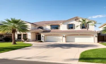 5100 square foot two level home in washington utah white brick, 4 car garage, has palm trees up the driveway
