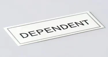 A paycheck with "DEPENDENT" stamped on it